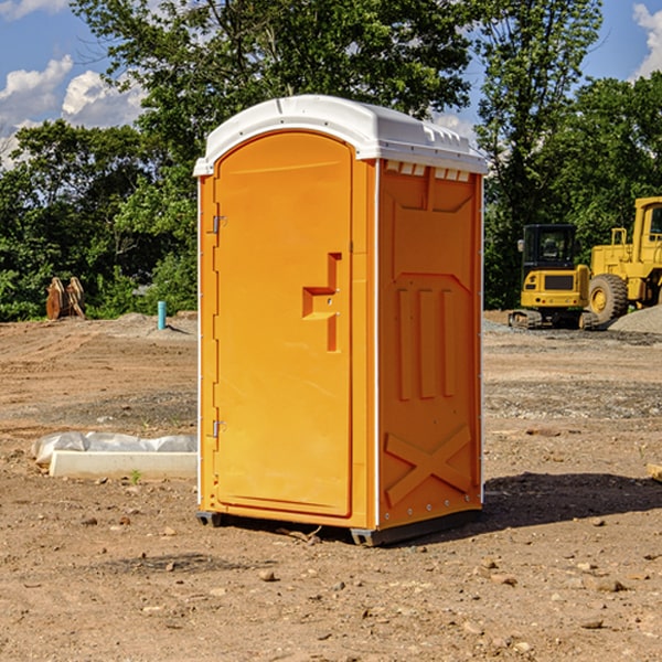 what is the cost difference between standard and deluxe portable restroom rentals in Calhoun County